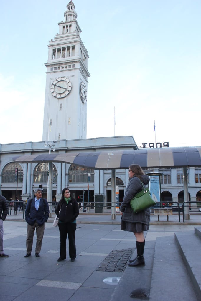 Jess Zimbabwe speaks to the fellows in front of the iconic Ferry Building.